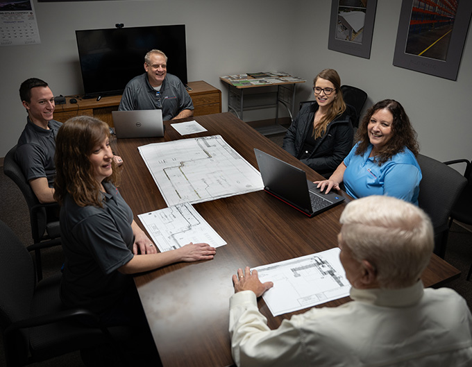 SIA group sitting at a table collaborating